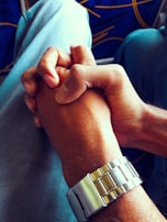 A close-up of hands shaking, symbolizing partnership.