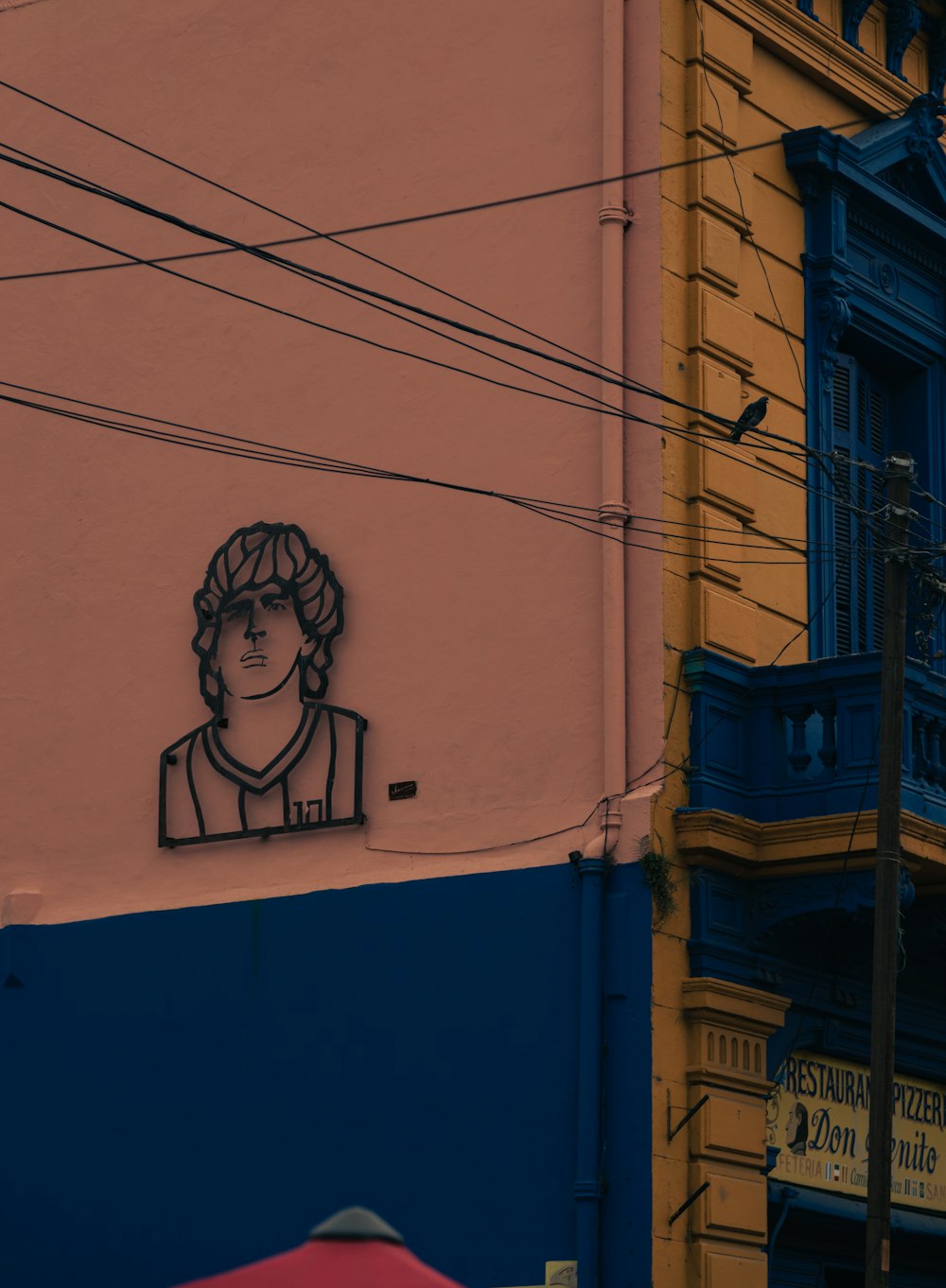 a drawing of a woman on the side of a building