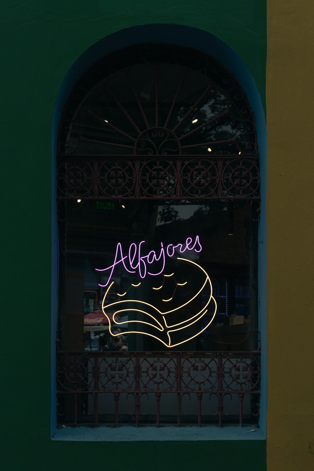 a window with a neon sign on it