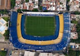 an aerial view of a soccer field in a city
