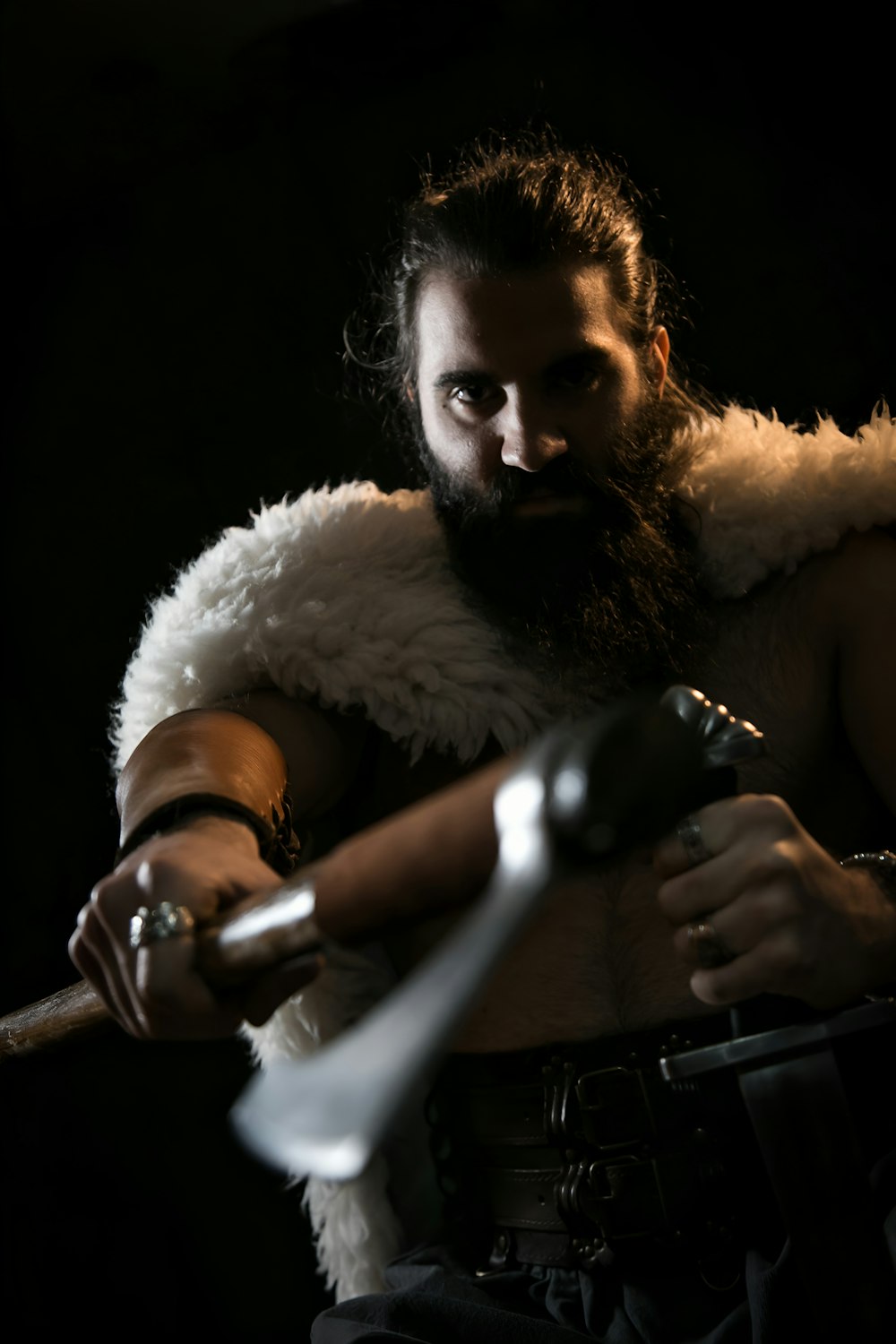 a man with a sword and a beard