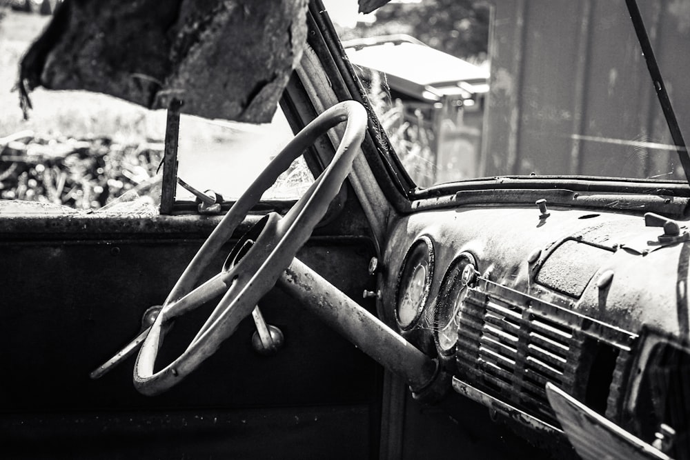 a black and white photo of an old car