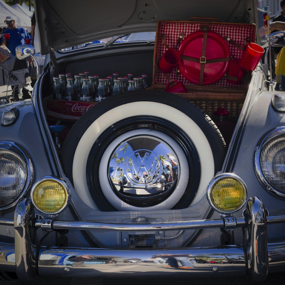 a close up of a car's trunk with its hood open