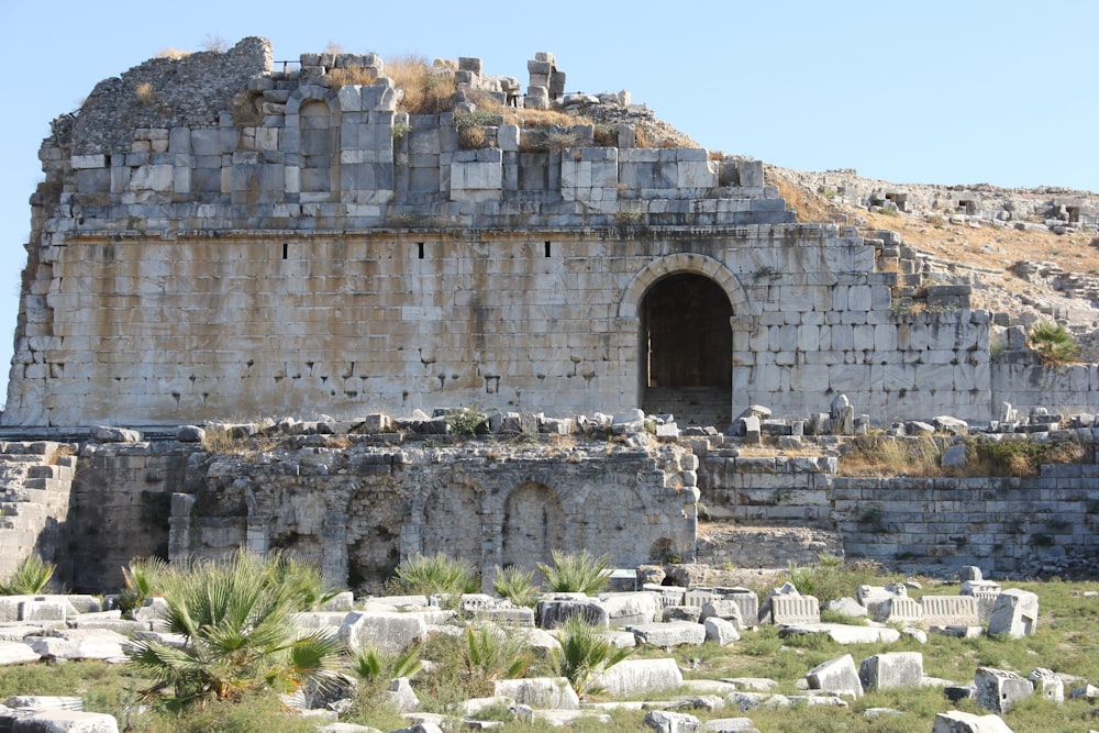 a stone structure with a doorway in the middle of it