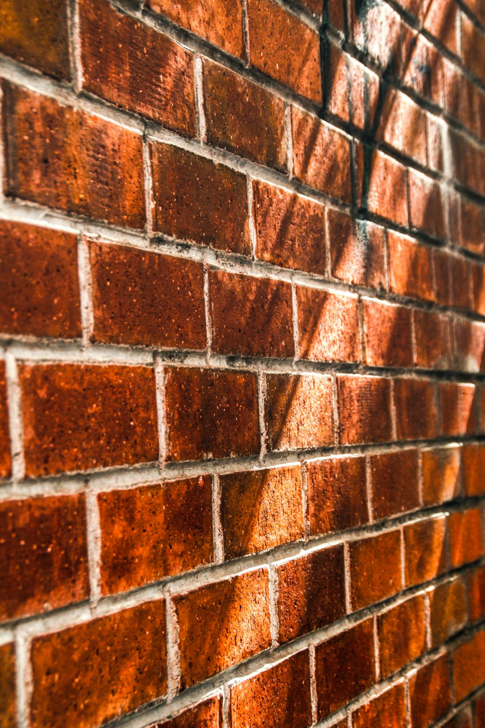 a close up of a red brick wall