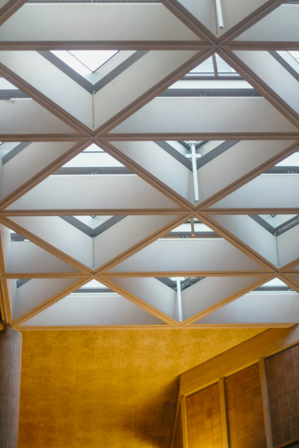 a large room with a cross on the ceiling