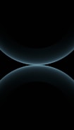A minimalist design featuring two large, smooth, curved shapes that resemble abstract spheres. The color is a subtle gradient of dark blues against a black background, giving a futuristic and celestial appearance.