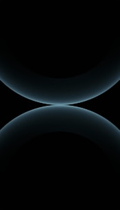 Minimalist design featuring overlapping solid blocks of celeste and orange colors.