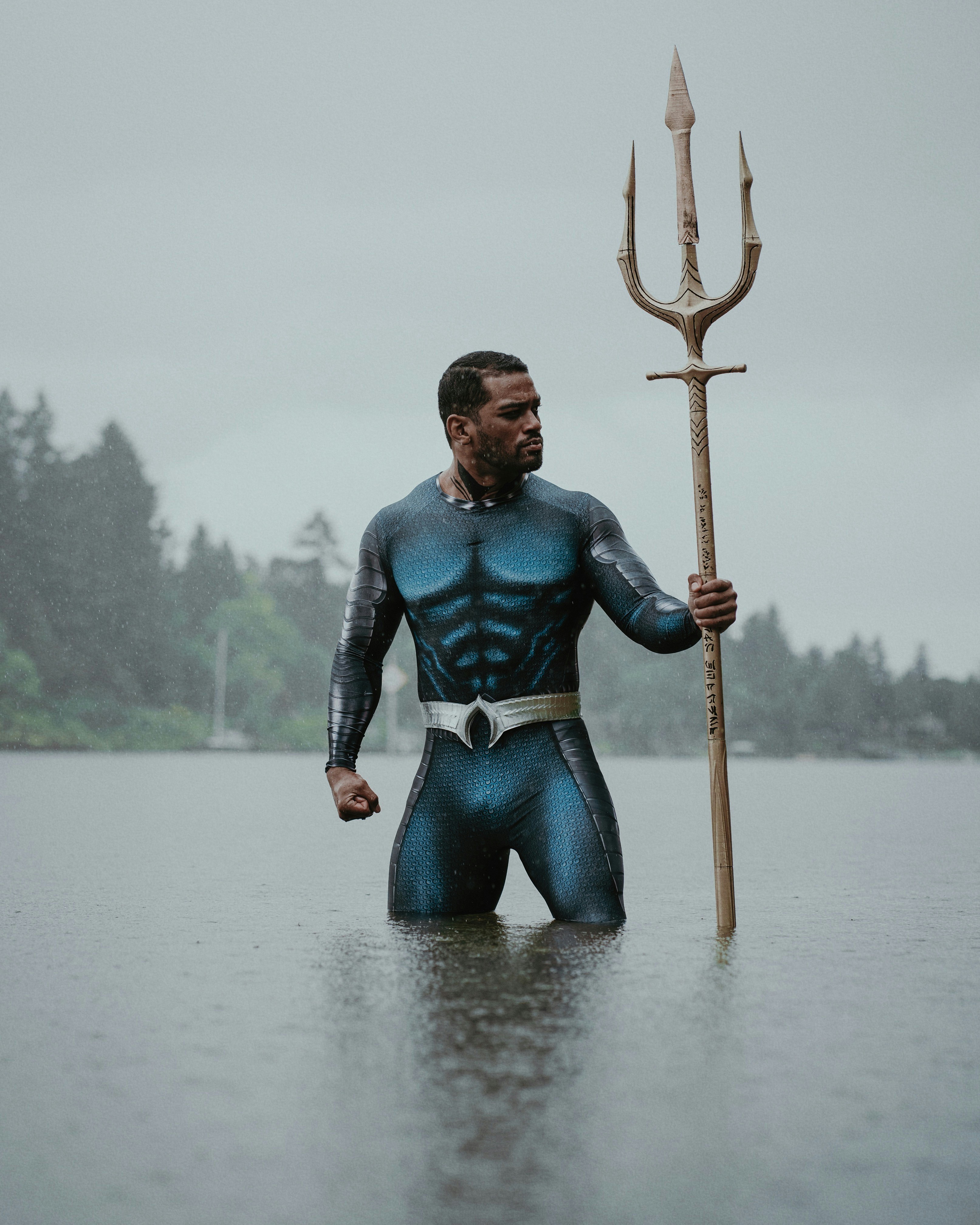 Portrait of male model Billy Dunston wearing an Aquaman costume posing in the rain. Photo by Portland Photographer Lance Reis. KickassDesigns on Insta :)