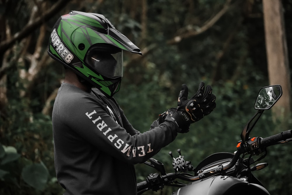 a person wearing a helmet and gloves on a motorcycle