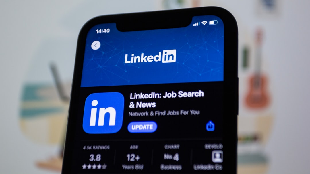 the linkedin logo is displayed on a smartphone,