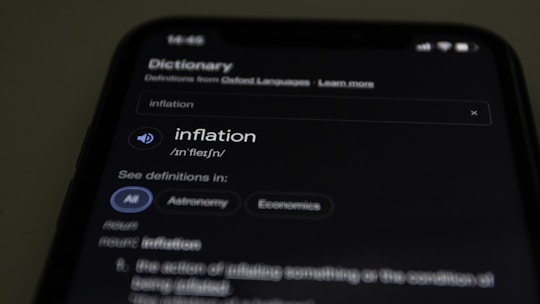 a close up of a cell phone with information on the screen