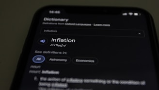 a close up of a cell phone with information on the screen