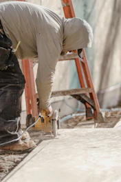 a man working on a piece of wood