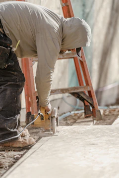 a man working on a piece of wood