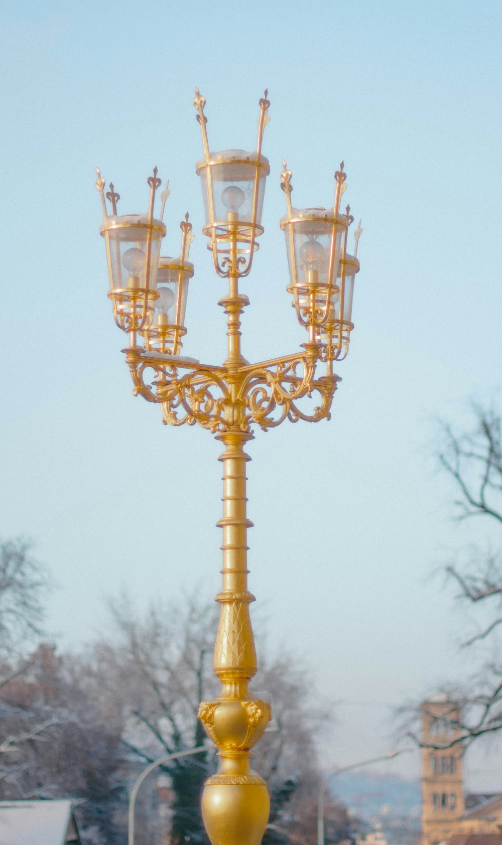 a street light with four lights on top of it