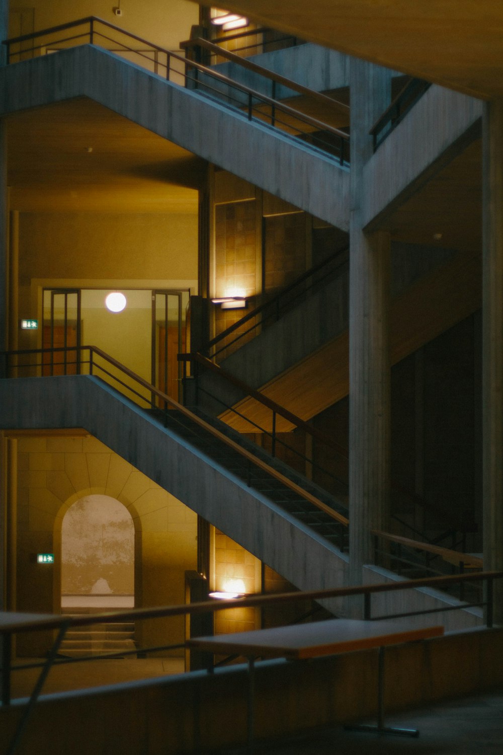 a couple of stairs in a building at night