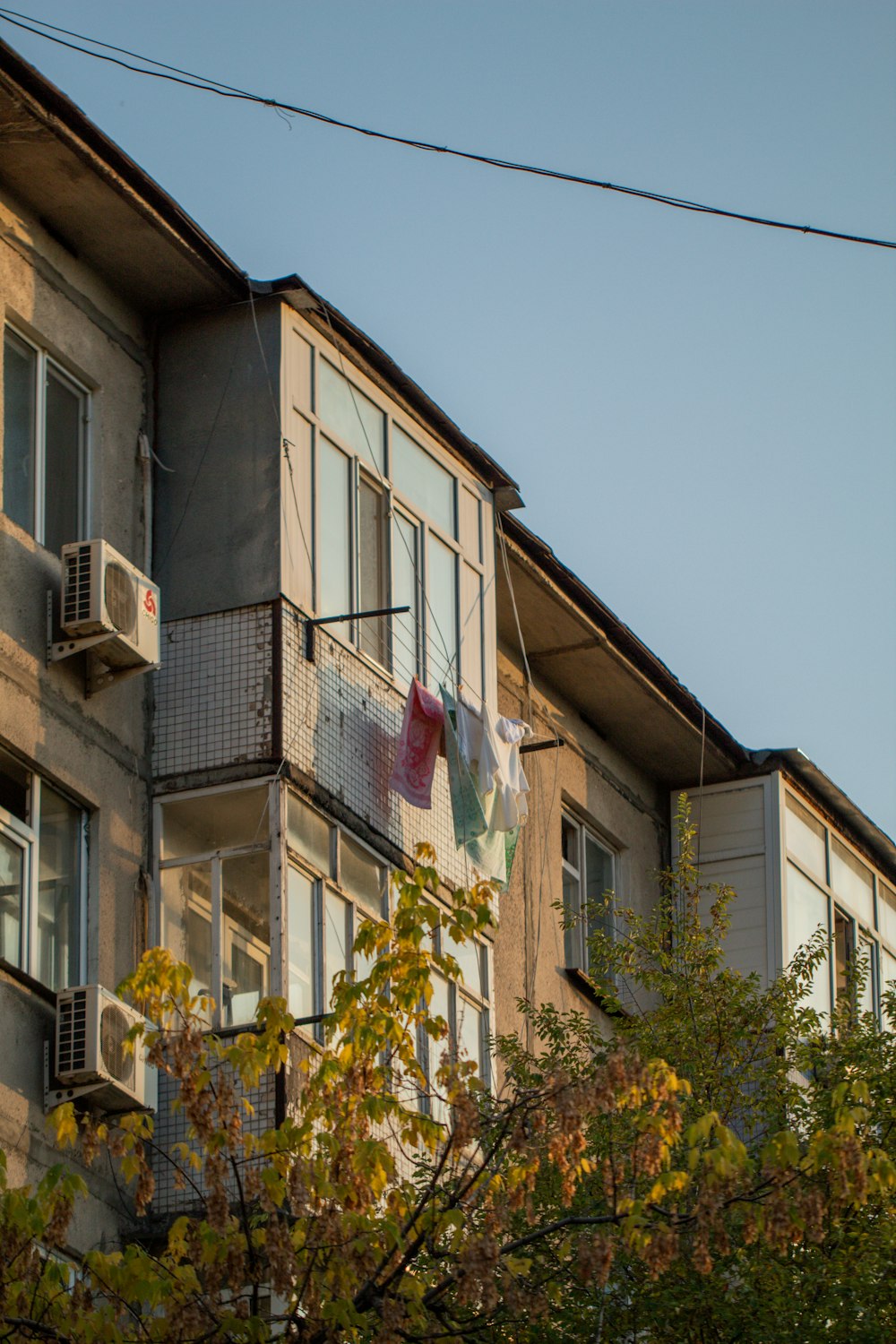 an apartment building with clothes hanging from the balconies