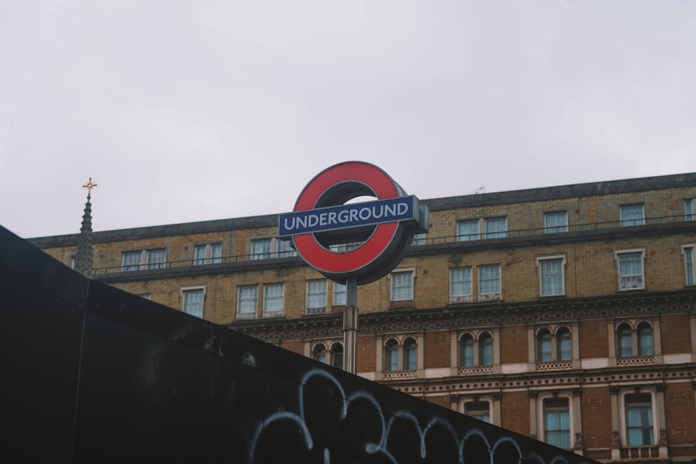 a red and black sign and some buildings