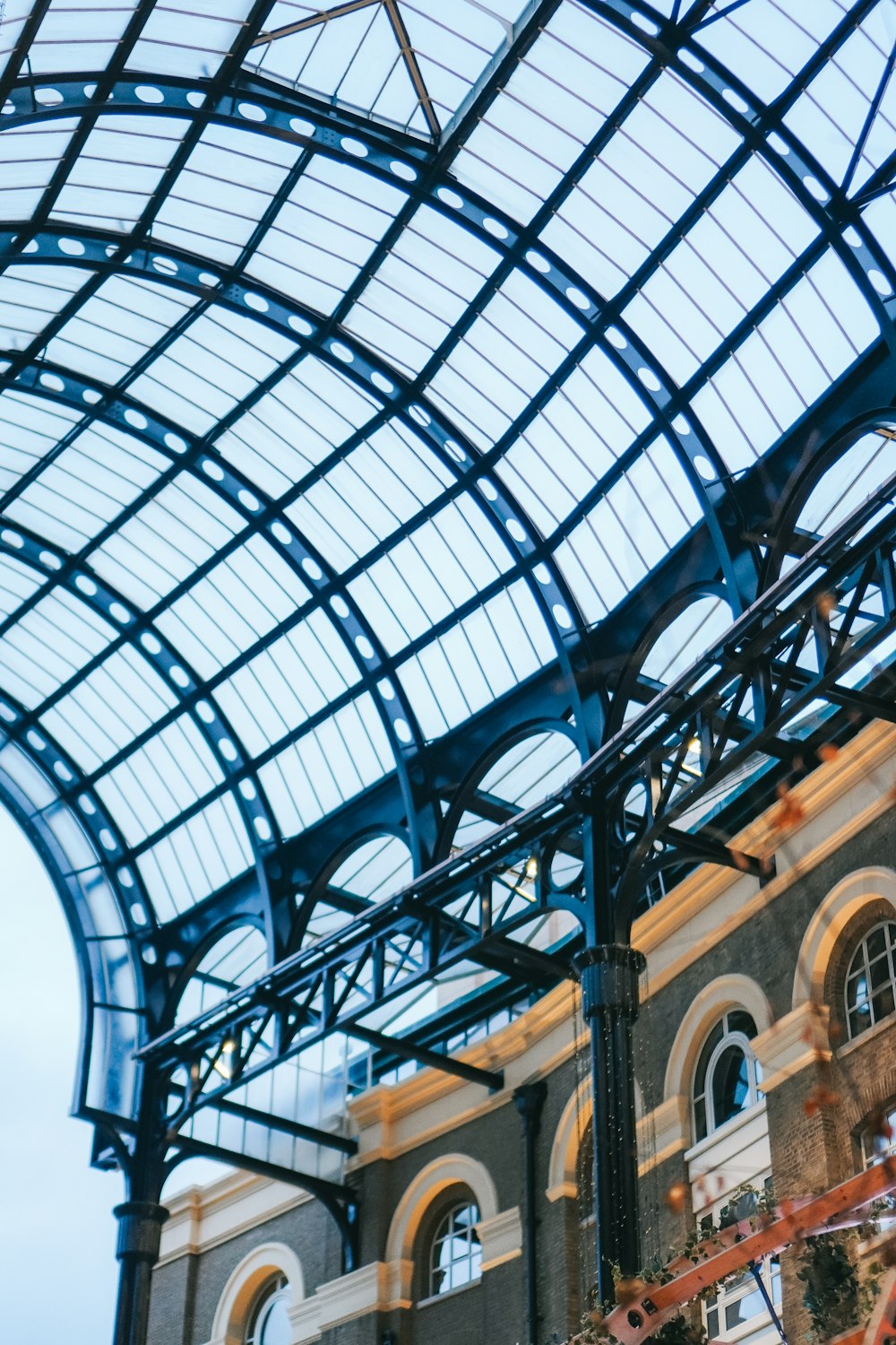 a train station with a clock on the side of it