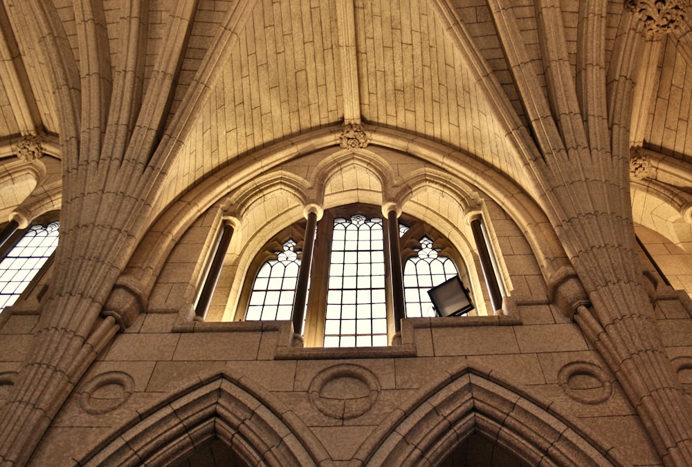 a large cathedral with three windows and a clock