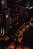 Night view of a city with highlighted vehicles being monitored by TrackElite.