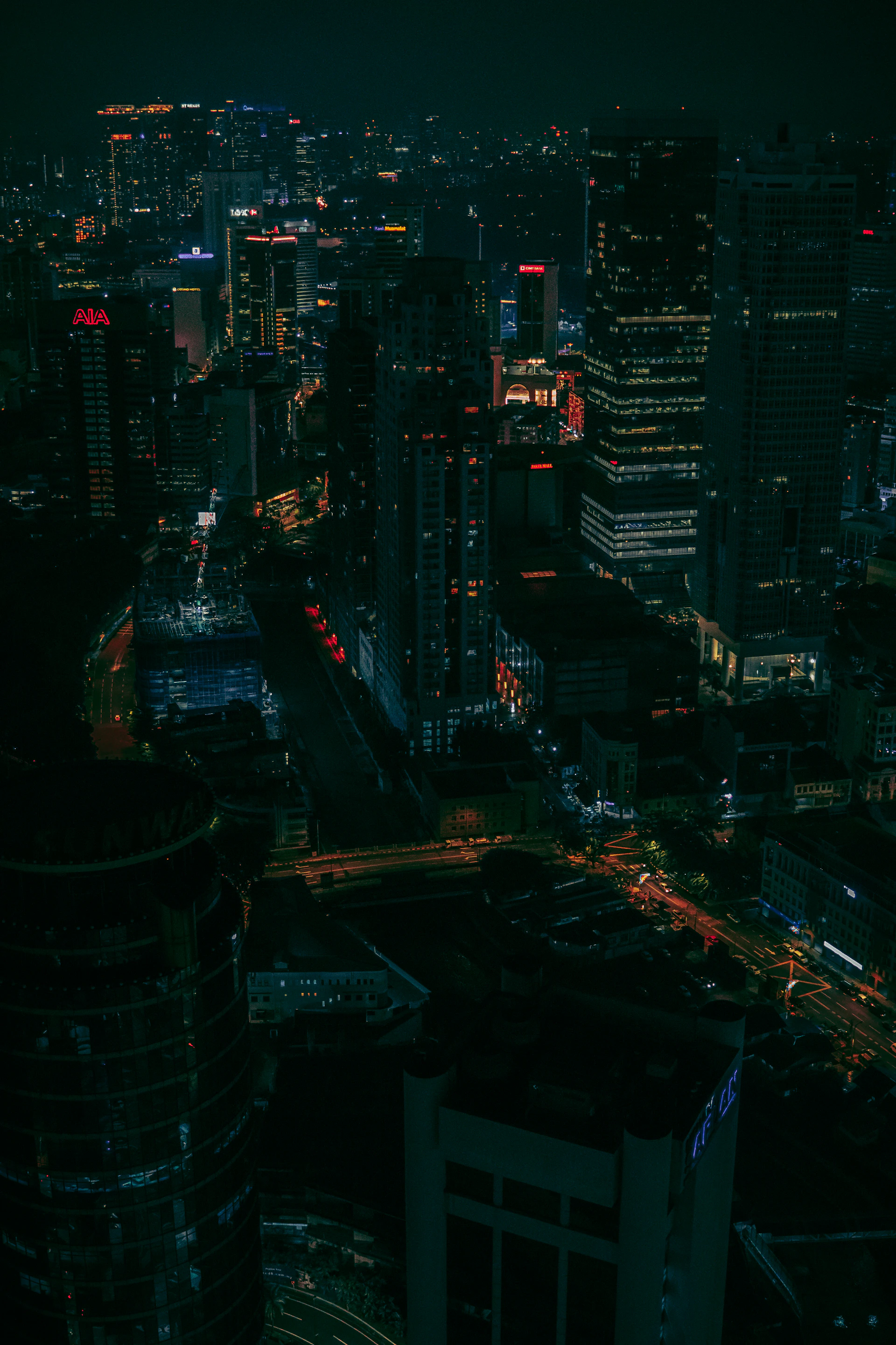 a view of a city at night from the top of a building