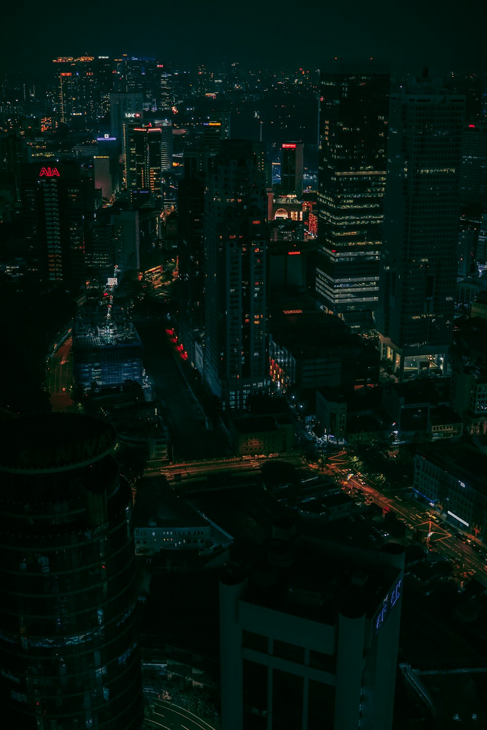 a view of a city at night from the top of a building