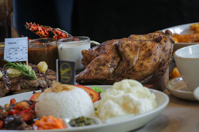 An inviting dining table set with various ready-to-eat meals.