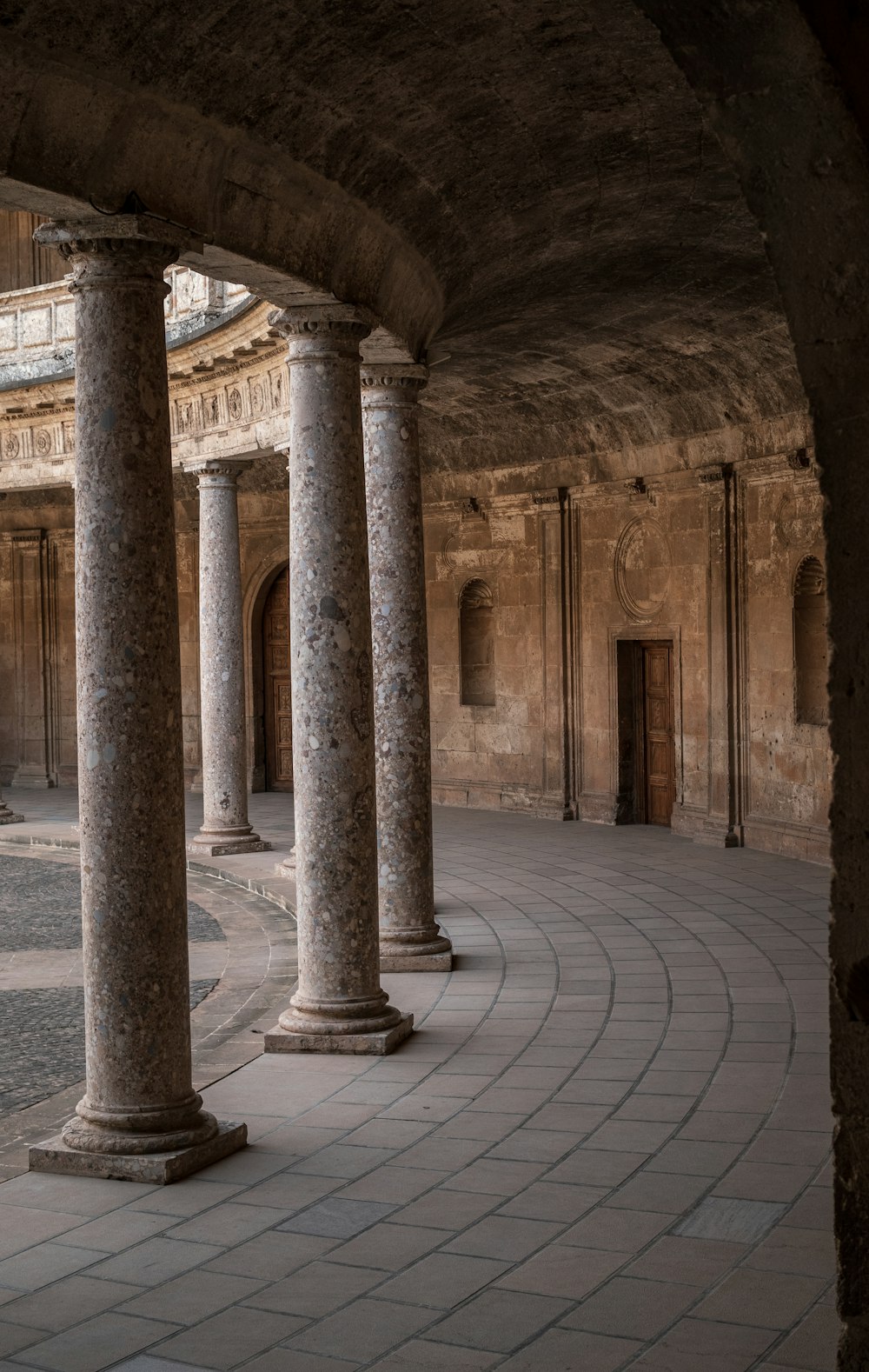 a large building with columns and a clock on the wall