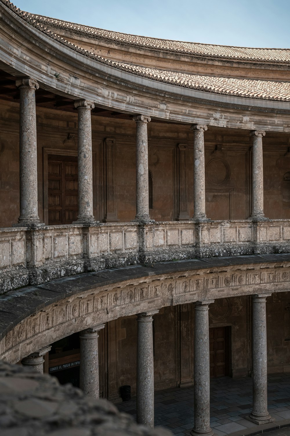 an old building with columns and a clock