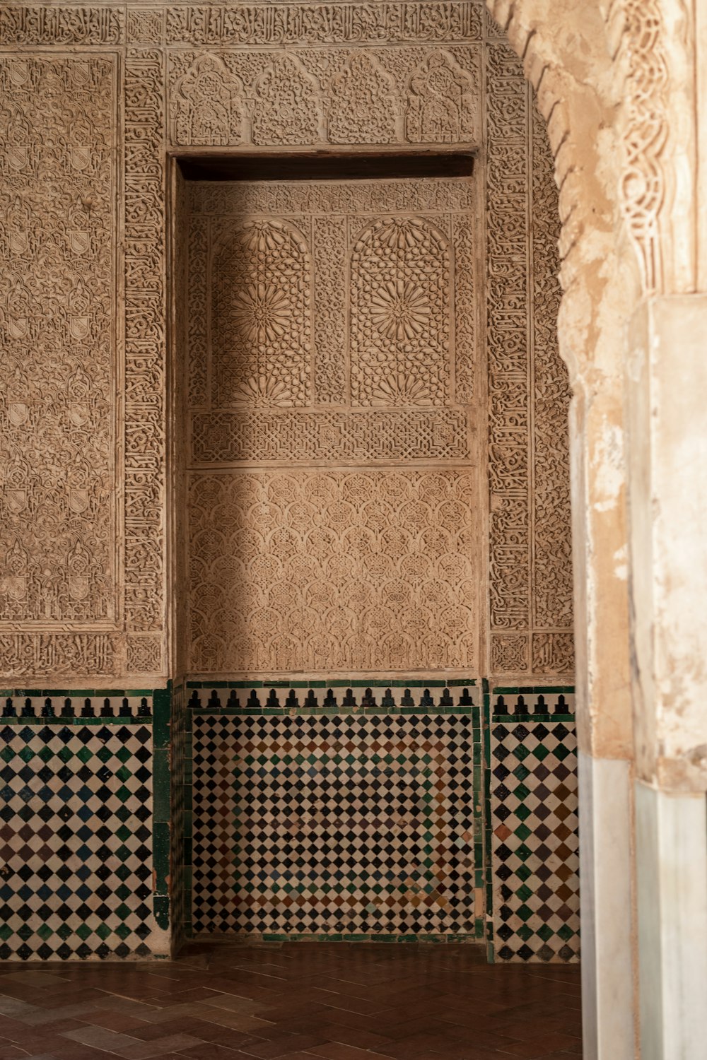 a room with tiled walls and a door