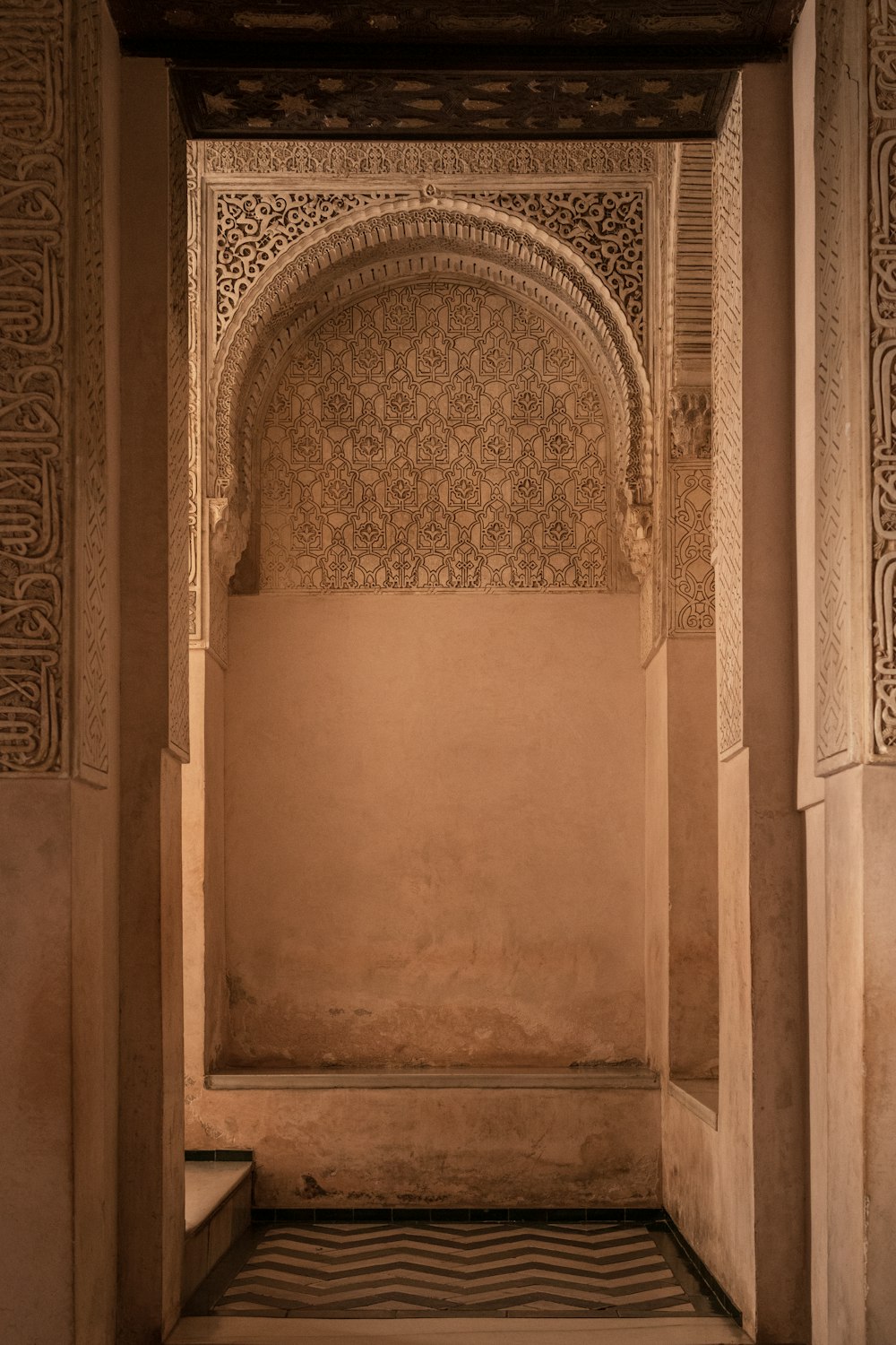 an archway in a building with a tiled floor