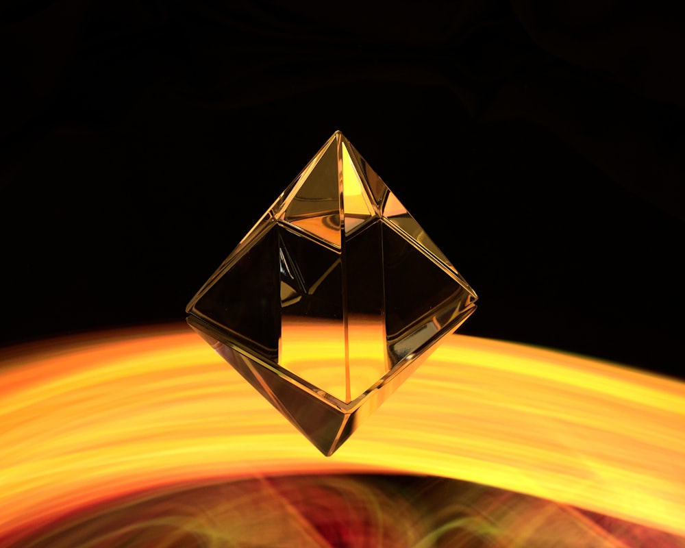 a diamond shaped object with a blurry background