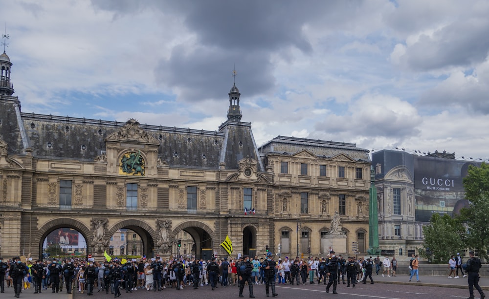 a large group of people standing in front of a building