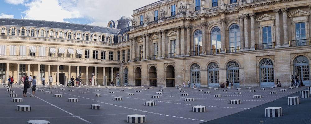 a large building with a lot of chairs in front of it