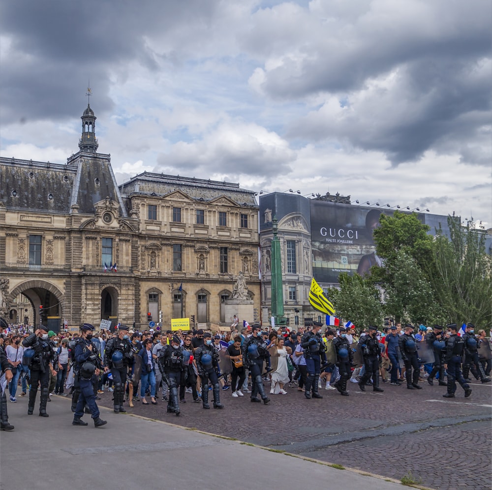 a large group of people standing in front of a building