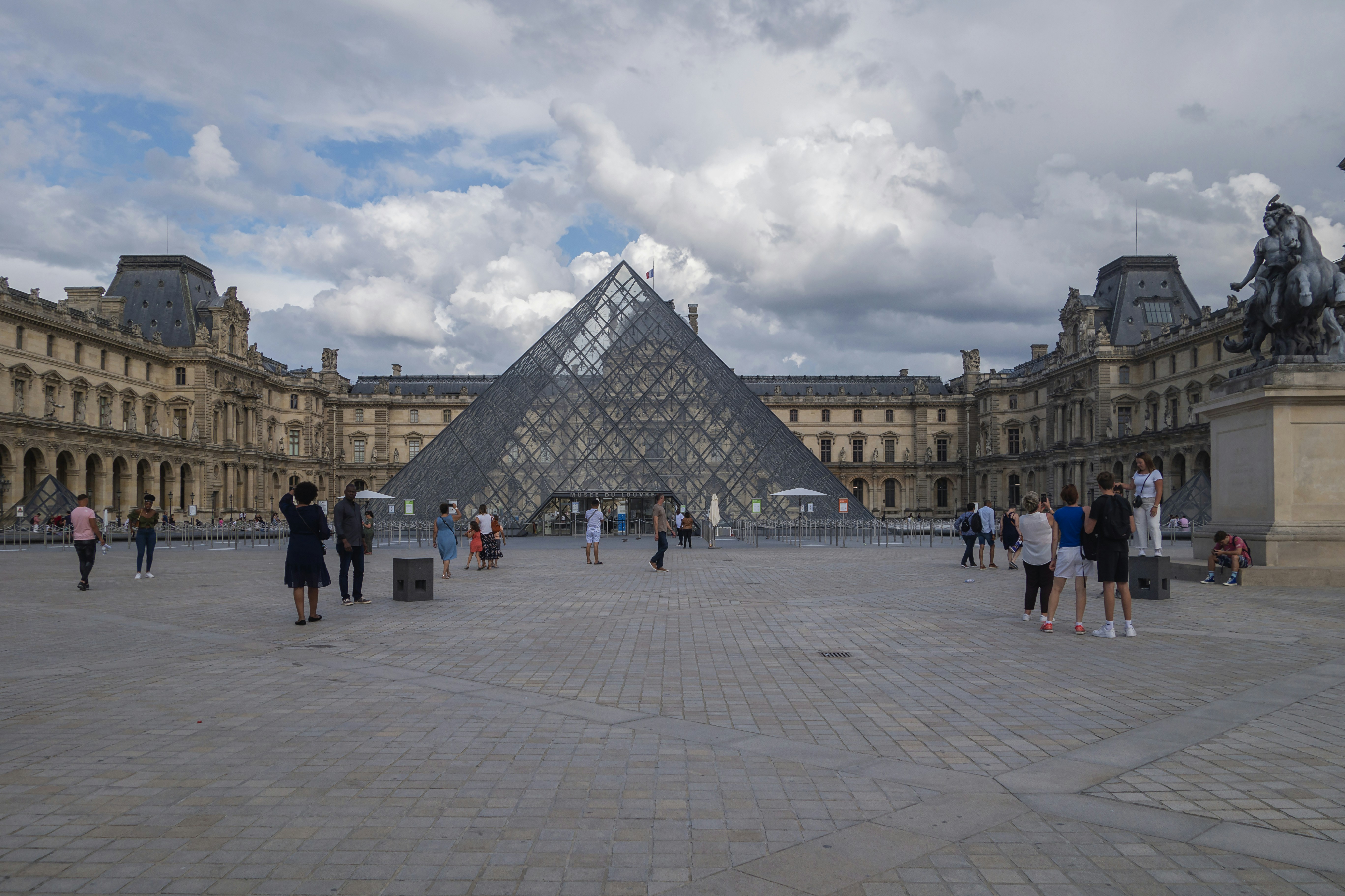 a group of people standing in front of a building