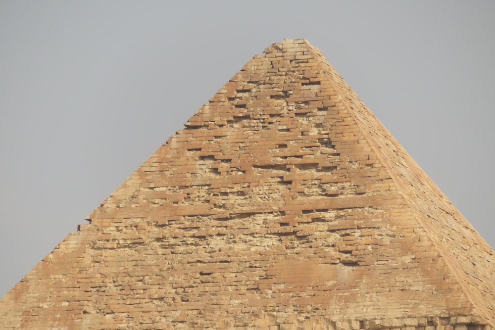 a very tall pyramid with a sky in the background