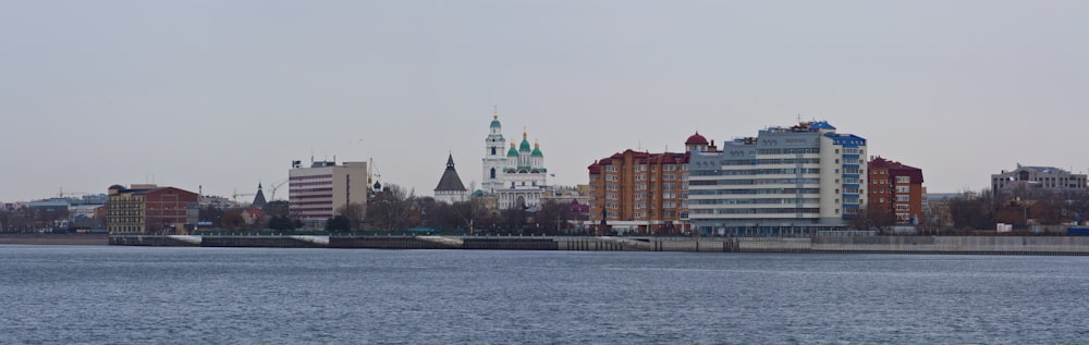 a large body of water with a city in the background