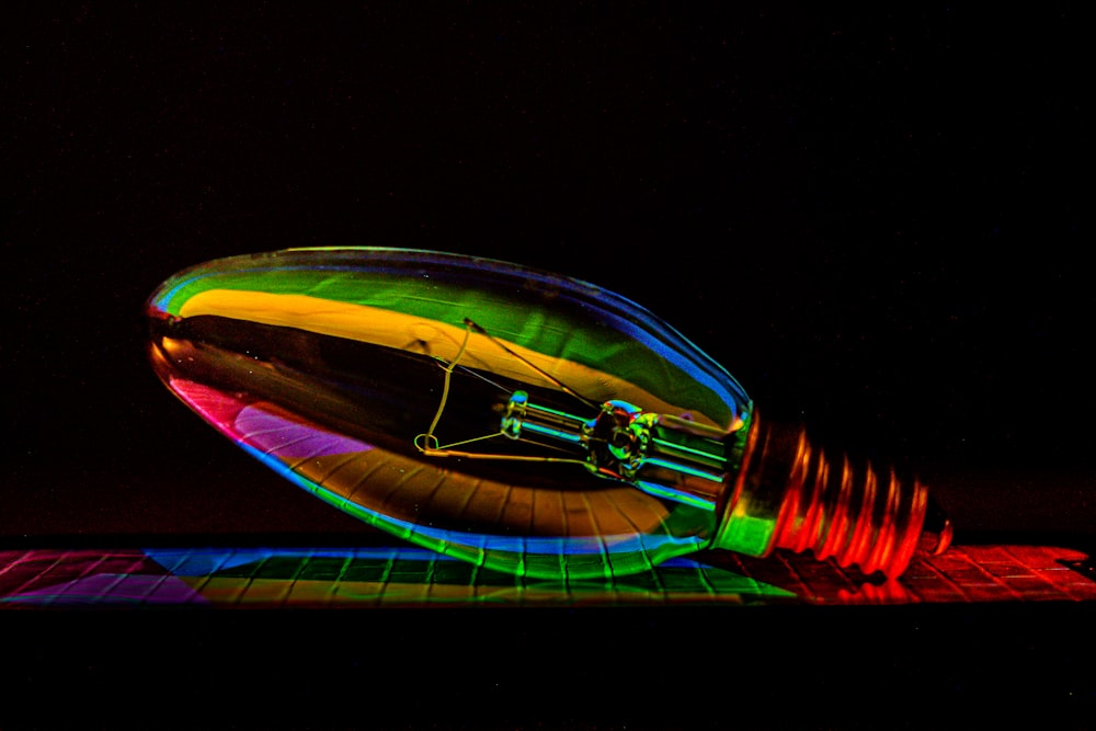 a colorful light bulb sitting on top of a table