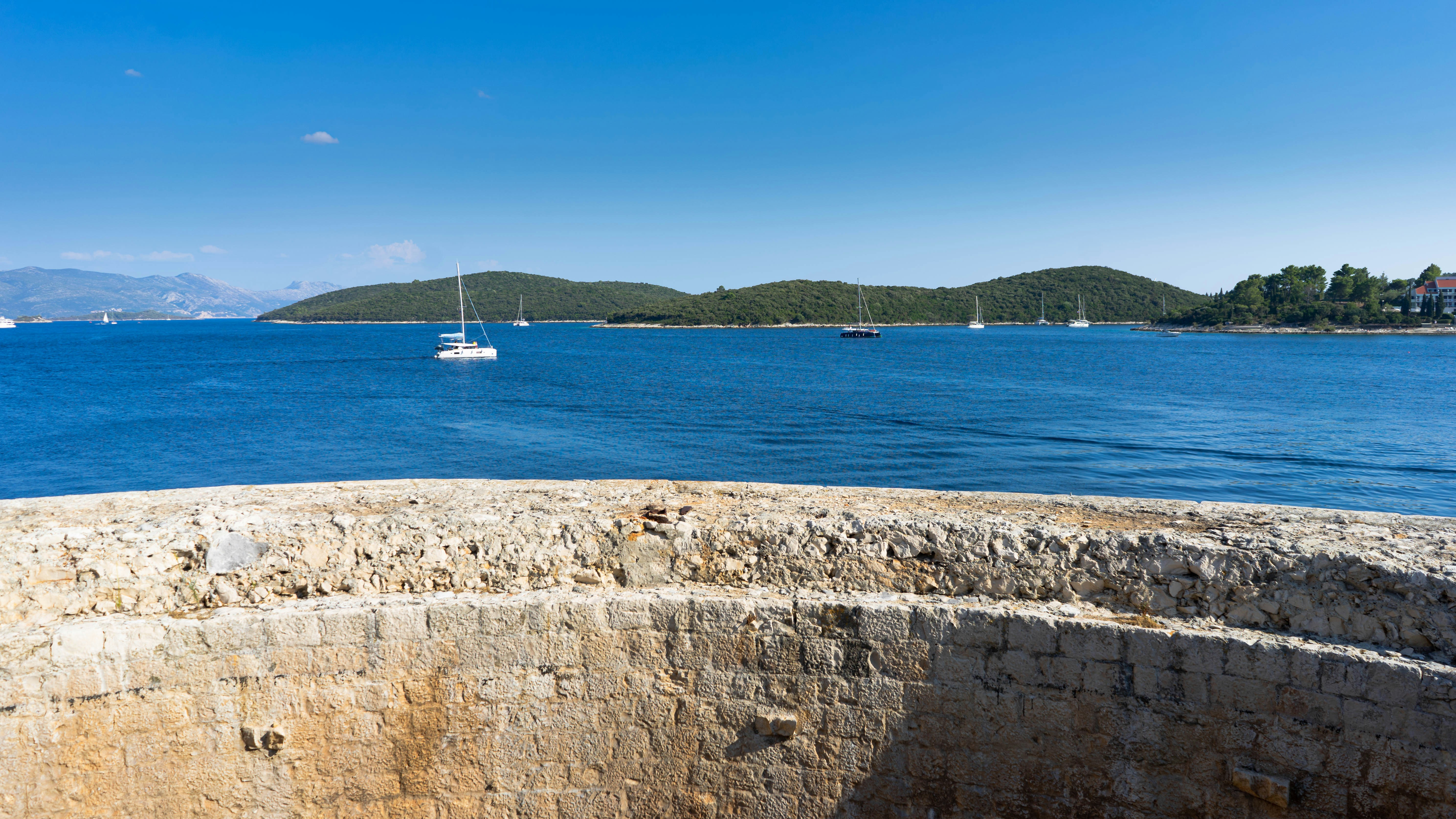 a body of water with a boat in the distance