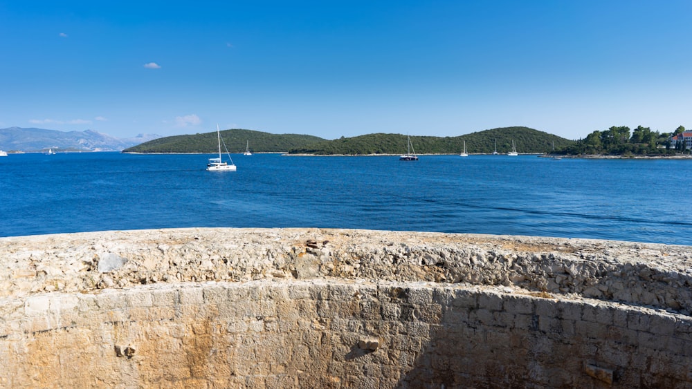 a body of water with a boat in the distance