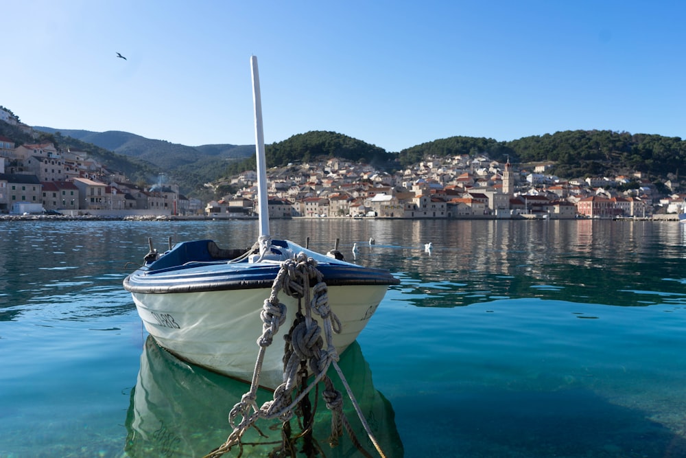 a small boat tied to a dock in the water