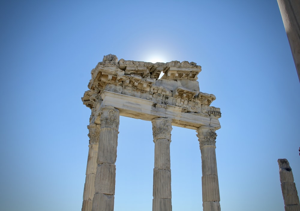 the sun is shining over the ruins of the ancient city