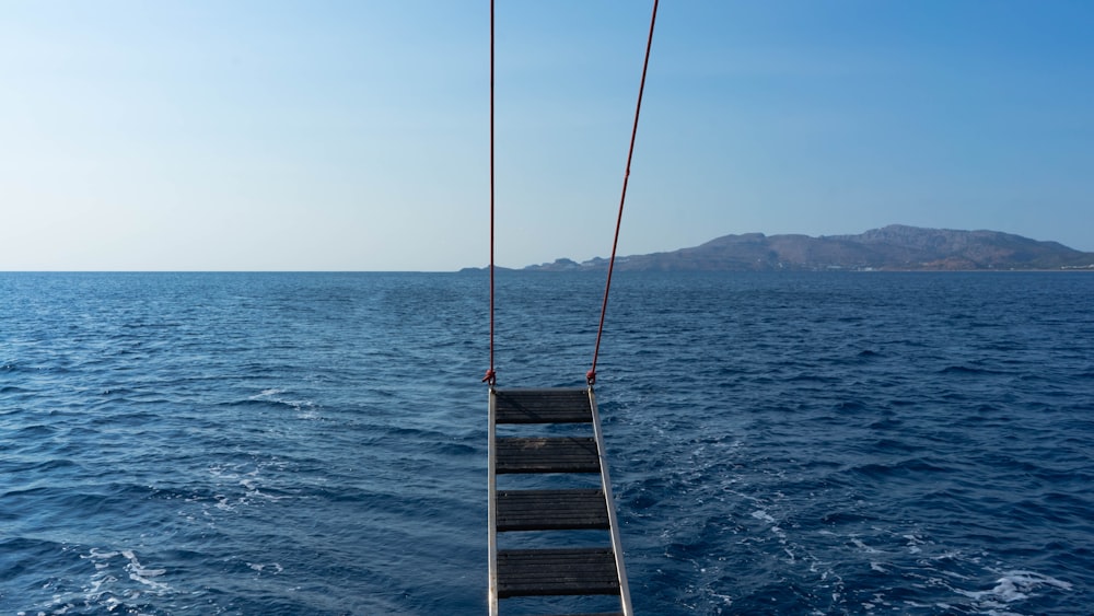 a roped off boat in the middle of the ocean