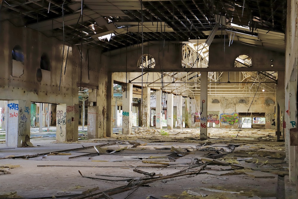 an abandoned building with a lot of debris on the floor