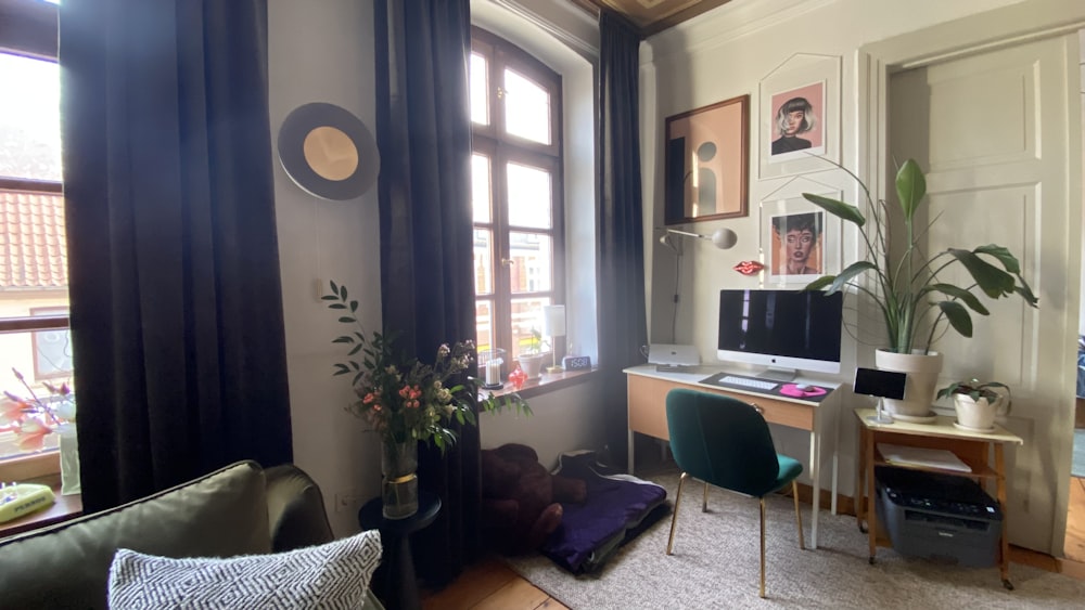 a living room filled with furniture and a large window