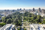 Aerial view of a modern city with green spaces.