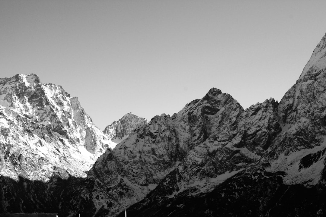 a black and white photo of a mountain range, Caucasus Mountains